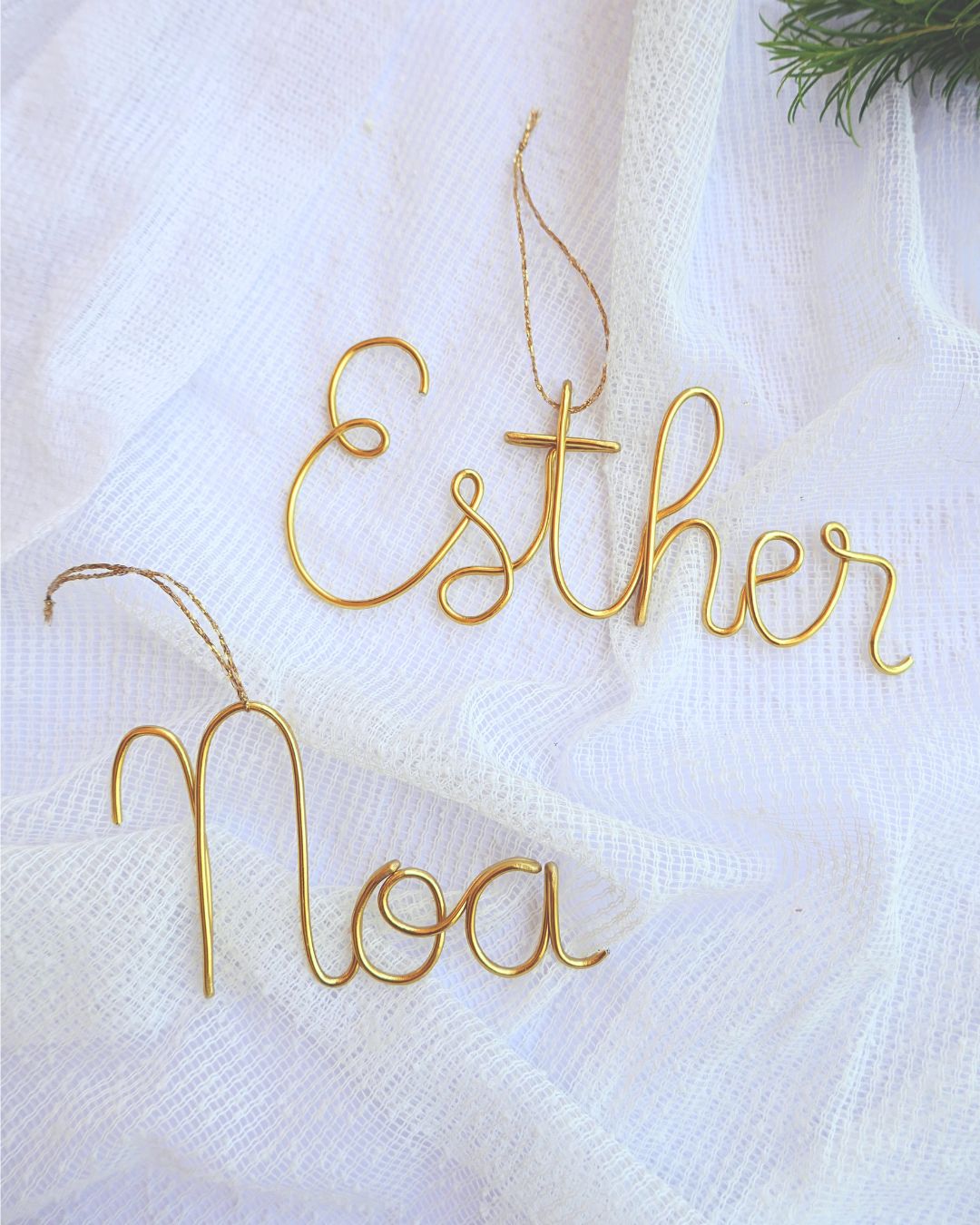 Handmade wire name ornaments.