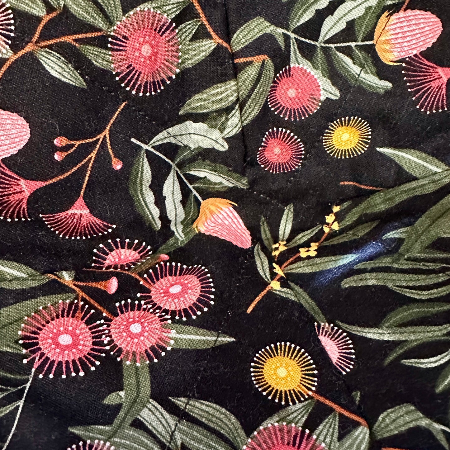 Close up of flowering gum fabric bowl cosy