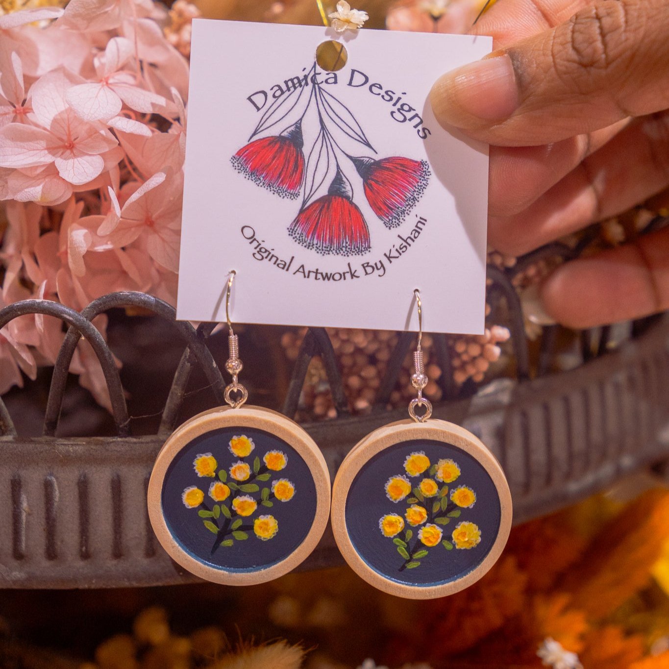 Cabachon dangle earrings painted with billy button flowers