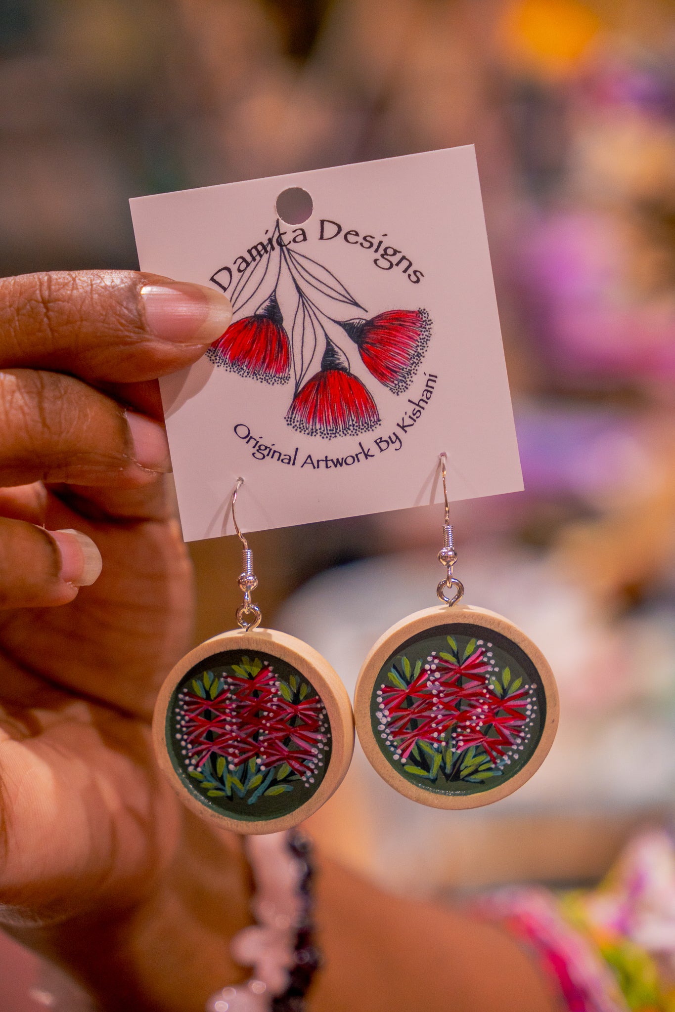 cabachon dangle earrings painted with bottle brush flowers