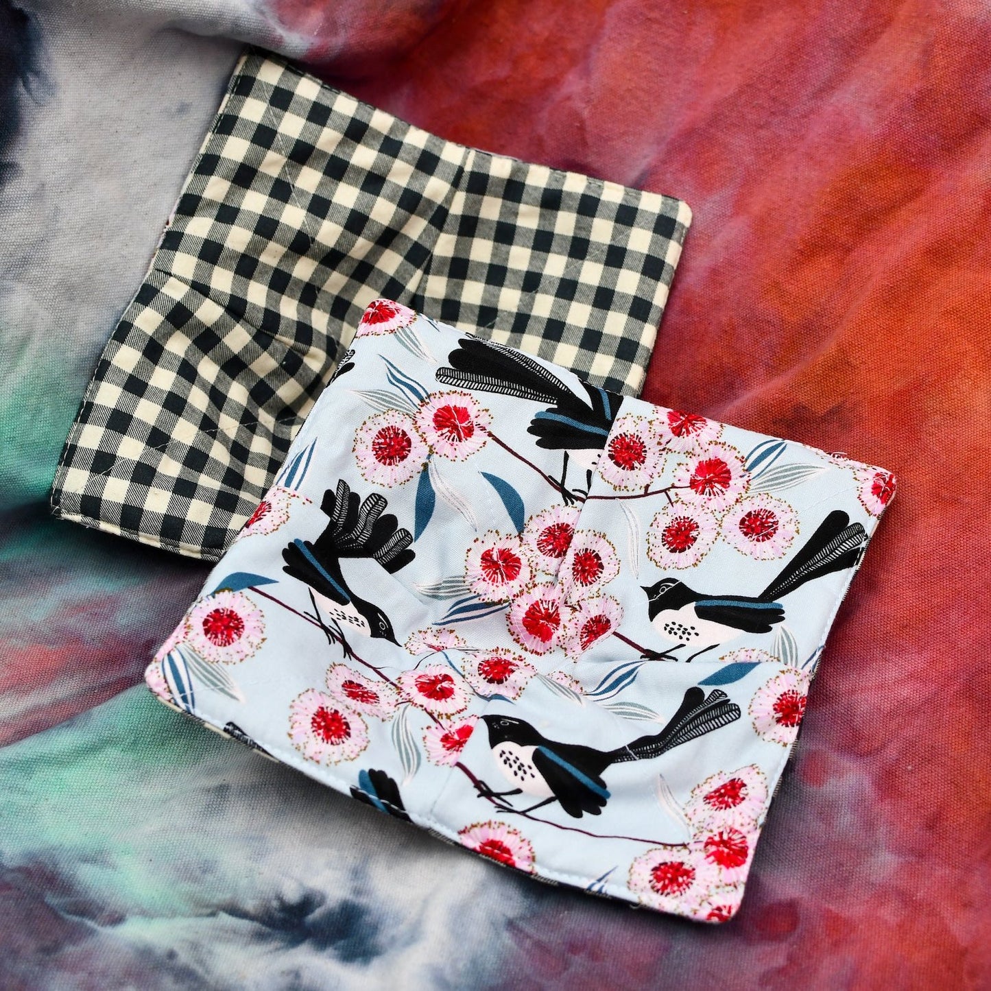 Bowl cosy with blue wren and flowering gum fabric with contrast black and white gingham fabric.
