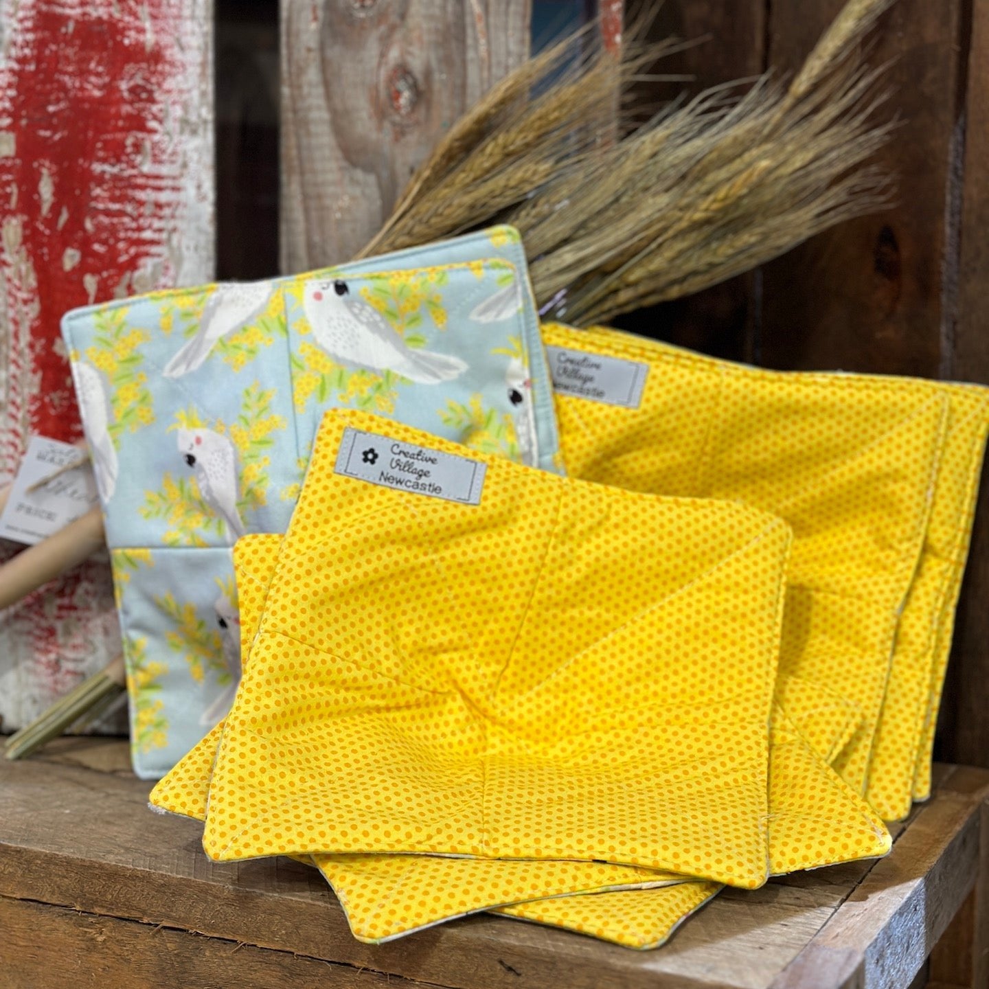 Bowl cosy with cockatoo in wattle fabric with yellow spotty lining fabric