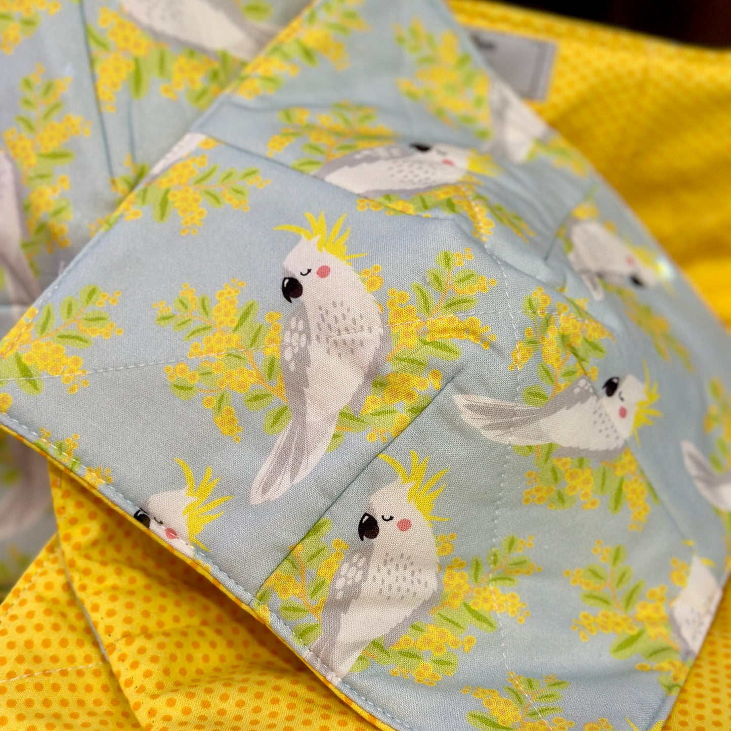 Close up of cockatoo fabric bowl cosy