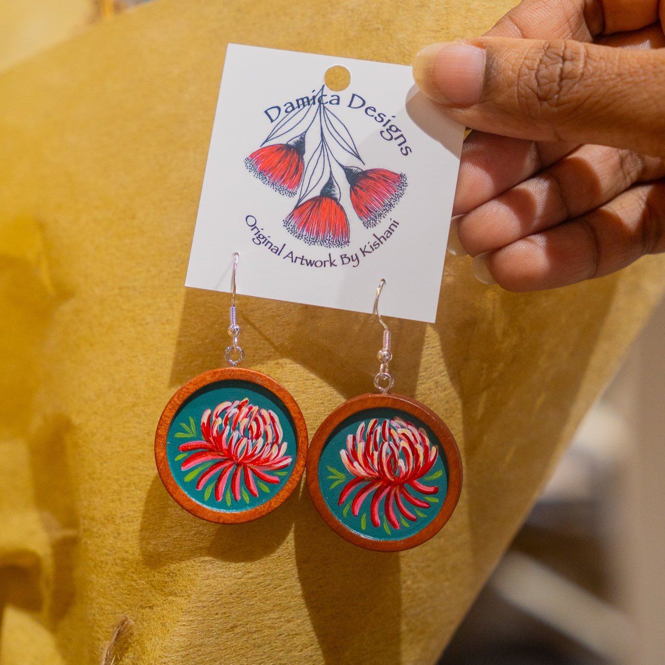 Cabachon dangle earrings painted with waratahs