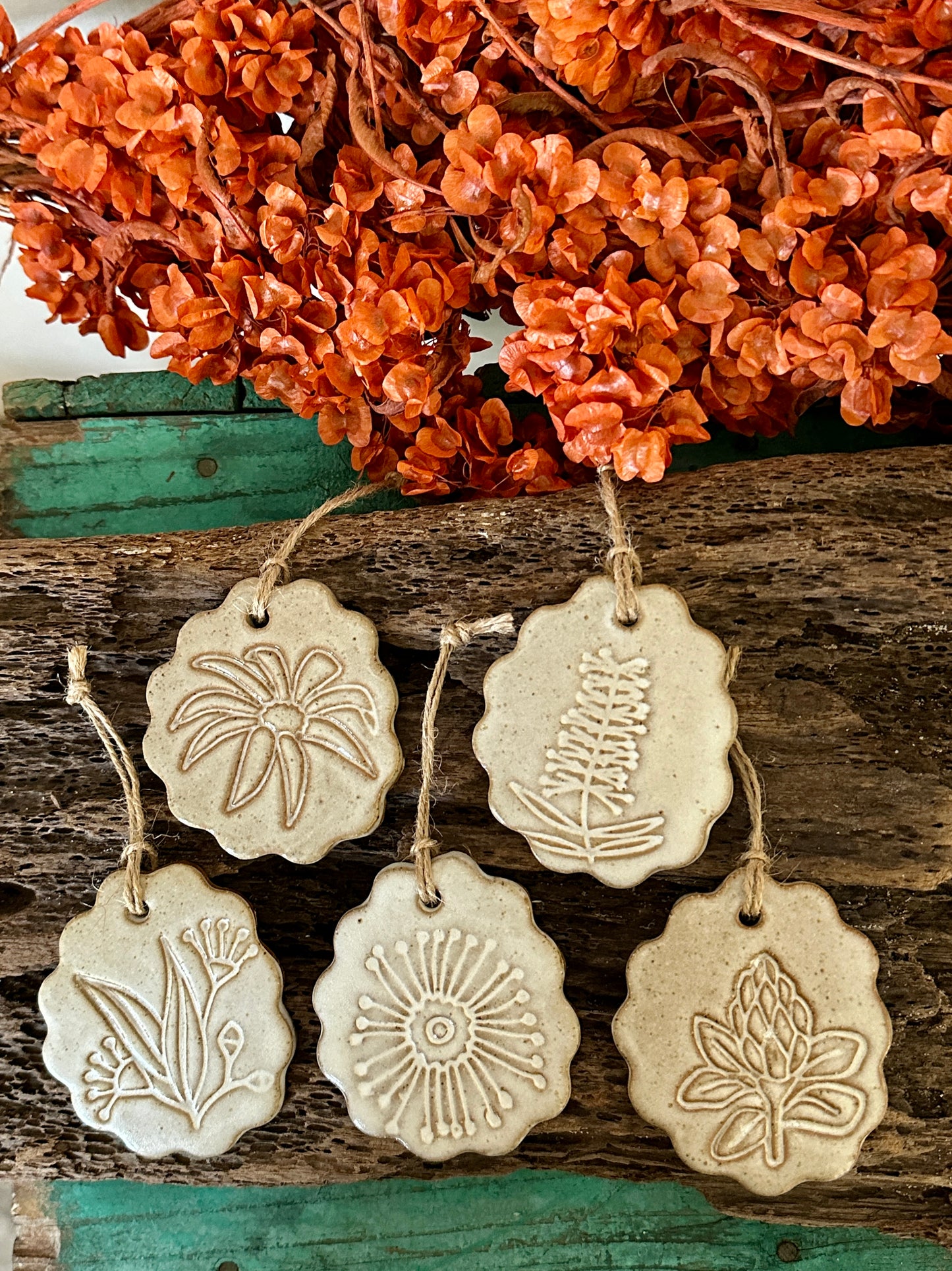 Handmade ceramic decorations with Australian flowers
