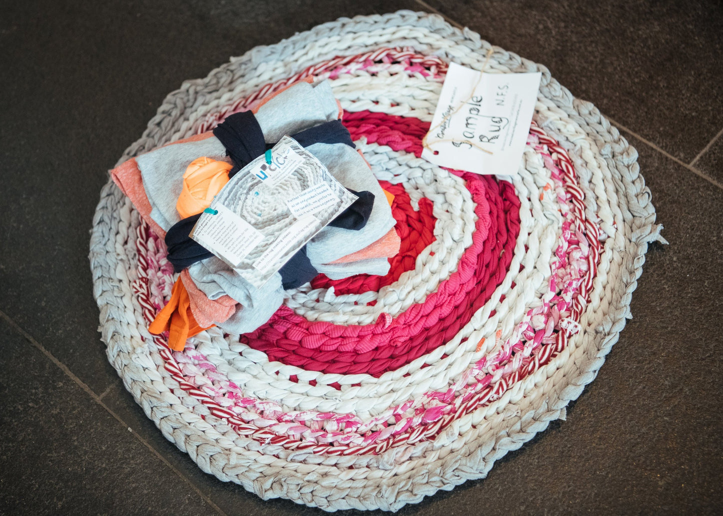 Example of a completed rag rug and a sample rag rug kit