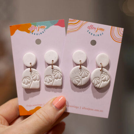 White deals clay earrings